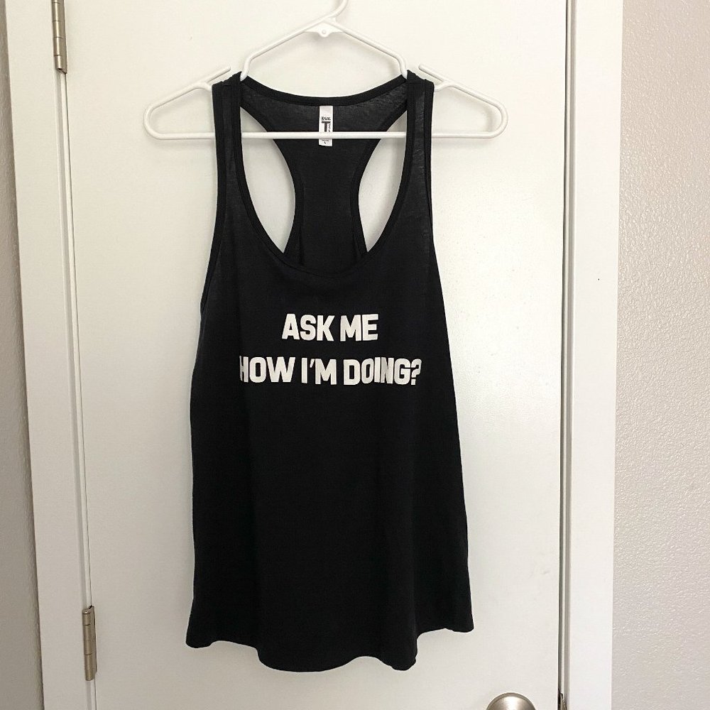 NWOT - Black tank top with hidden message when flip up the bottom